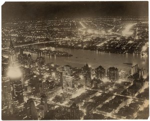 Oversized 1933 Associated Press nighttimed photo of New York City skyline shot from the Empire State Building. The image shows the East River, Manhattan and Long Island. 